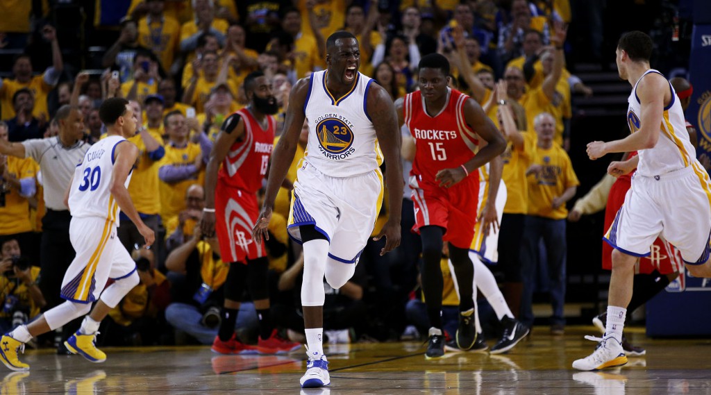 OAKLAND, CA - MAY 19: Draymond Green #23 of the Golden State Warriors celebrates in the second quarter against the Houston Rockets during Game One of the Western Conference Finals of the 2015 NBA Playoffs at ORACLE Arena on May 19, 2015 in Oakland, California. NOTE TO USER: User expressly acknowledges and agrees that, by downloading and or using this photograph, user is consenting to the terms and conditions of Getty Images License Agreement. (Photo by Ezra Shaw/Getty Images)